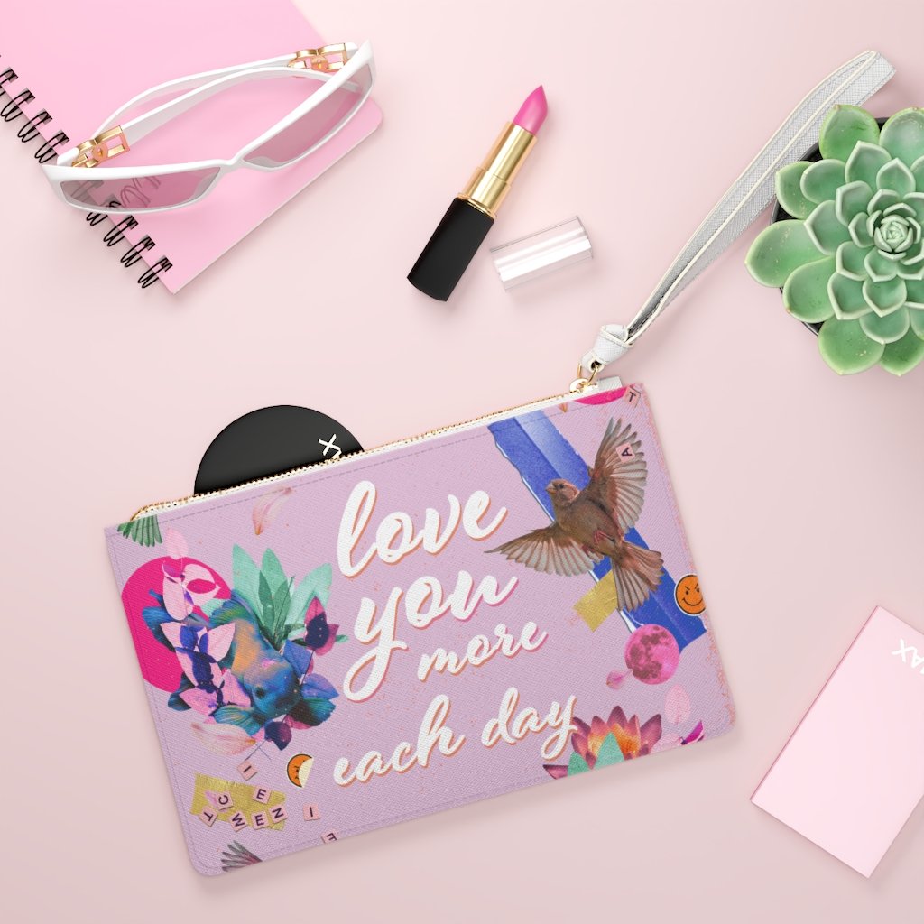 Love You More Each Day Floral Designed Zipped Clutch BagFloral Zipped Clutch Bag - Designed with a loop handle to quickly free your hands, this clutch bag is made for the fashionista on the go. It can hold everyday essentHandbagsEXPRESS WOMEN'S FASHIONYellow PandoraDay Floral Designed Zipped Clutch Bag