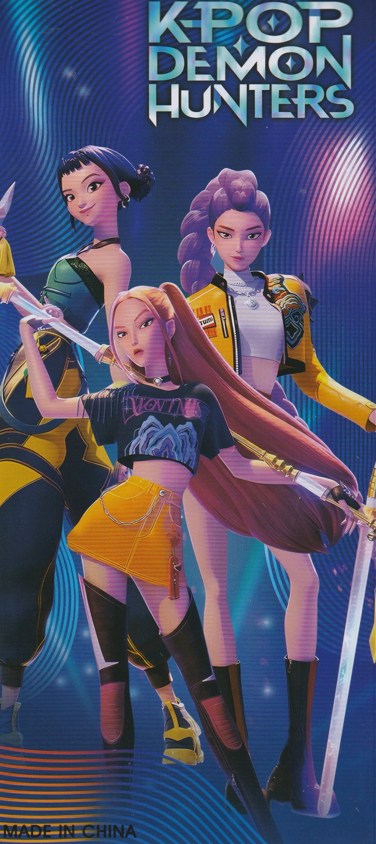 Vibrant K-Pop Demon Hunters artwork showing all four anime characters in dynamic poses on the back of the doll packaging.