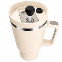 Black magnetic silicone straw cover cap attached to a 40oz insulated stainless steel travel tumbler with handle and leak resistant straw lid for reusable iced coffee and hydration use