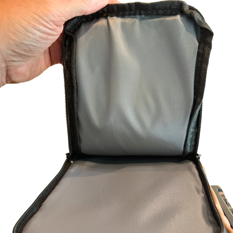 Open men's crossbody chest bag showing large interior storage pocket with zipper closure