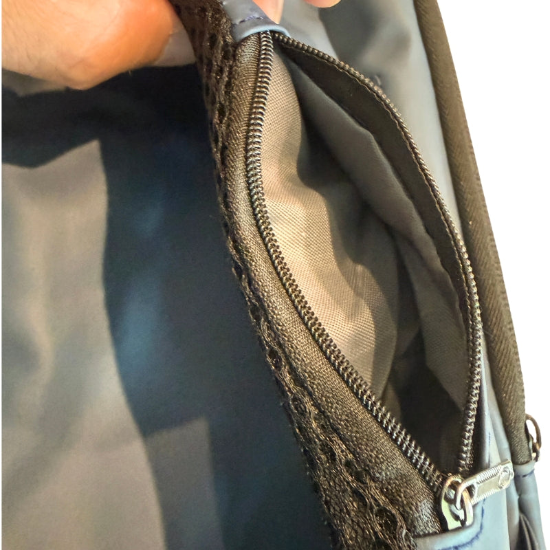 Close-up of men's crossbody chest bag side zipper pocket showing extra storage and durable fabric lining