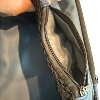 Close-up of men's crossbody chest bag side zipper pocket showing extra storage and durable fabric lining