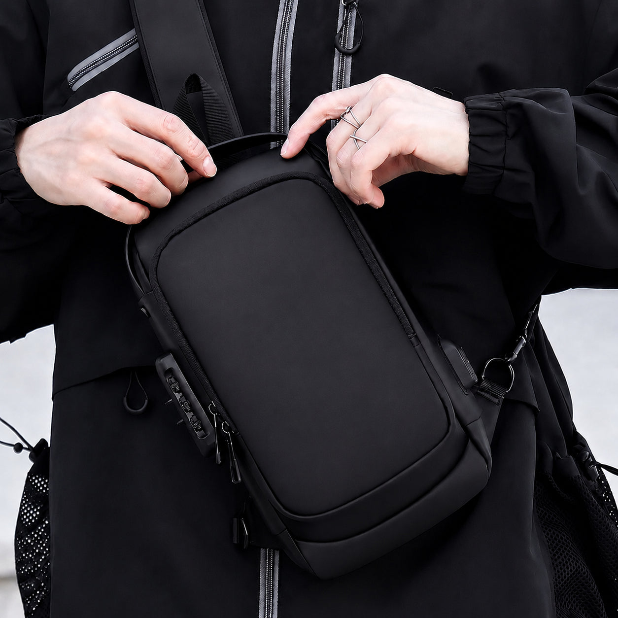 Man wearing a water resistant anti theft crossbody sling bag for travel and everyday carry